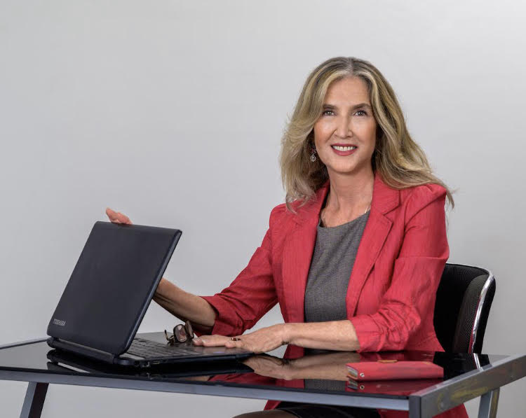 Roula Selinas at her Desk with laptop